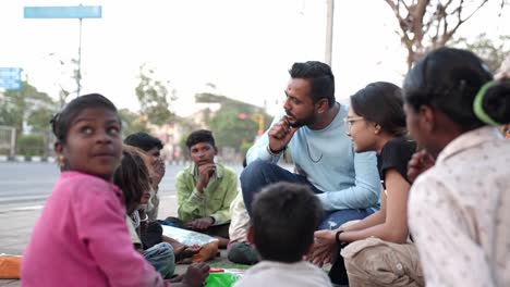 Cinematic-Shot-slow-motion-seen-in-which-a-brother-is-playing-games-and-also-teaching-the-small-children-of-the-slum-area