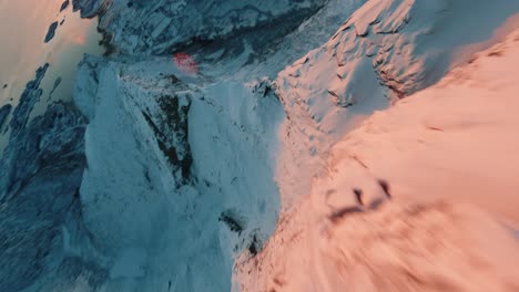 FPV-Drone-flight-in-Lofoten-sunset-over-a-mountain