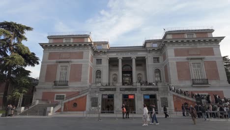 left-to-right-pan-establishing-shot-of-Madrid-Museo-del-Prado-main-entrance-museum-during-sunny-winter-day