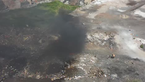 Establishing-Shots-run-from-above-camera-shows-many-people-burning-plastic-waste-and-large-dumping-yard-is-visible