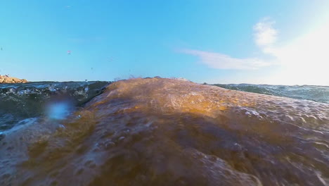 Surfer-Paddling-Out-To-The-Surfing-Lineup