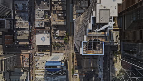 Calgary-AB-Canada-Aerial-v40-top-down-view-drone-flyover-downtown-commercial-area-along-7-Ave-Sw-capturing-high-rise-buildings-and-light-rail-street-from-above---Shot-with-Mavic-3-Pro-Cine---July-2023