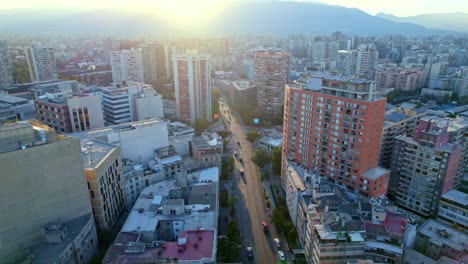 Aerial-Drone-Flyover-Santiago-Main-City-With-Traffic-And-Andes-Mountains-At-Dawn,-4K-Chile-Chiloe