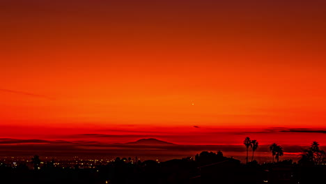Time-Lapse,-Night-Above-Los-Angeles-USA,-Lights-and-Clouds-Above-Red-Skyline