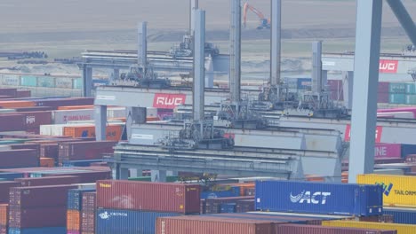 Cranes-At-Work-In-Rotterdam-World-Gateway-Port-In-Maasvlakte,-Netherlands---Wide-Shot