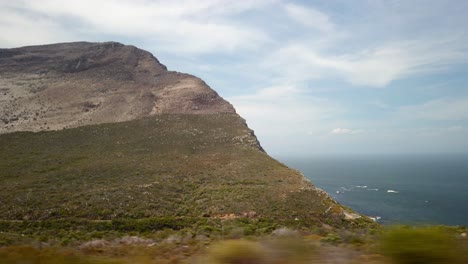 Panoramic-Point-of-view-inside-car-window's-cape-of-new-hope-south-African-cliff-beach-landscape,-skyline-and-environment-geological-formations