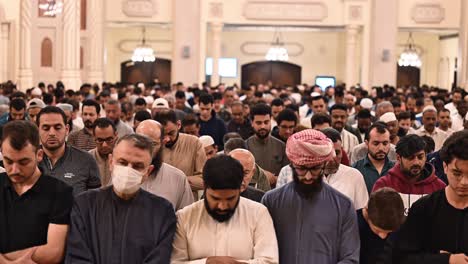 Faithful-performing-Taraweeh-prayer-during-Ramadan-2024-at-a-mosque-in-Sharjah,-United-Arab-Emirates