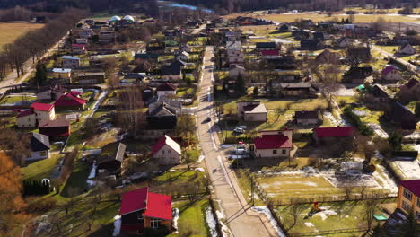 Koceni-parish-with-long-shadows-from-trees-and-slanted-roofs-iconic-to-Latvia