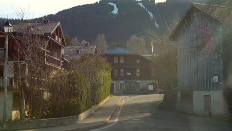 Panning-shot-of-a-snow-free-village-in-the-French-Alps-this-winter