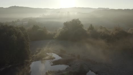 Bucolic-landscape-on-foggy-morning.-Aerial-forward