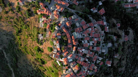 Aerial:-Top-down-drone-shot-of-the-beautiful-Village-of-Alonnisos-island-in-Sporades,-Greece-during-sunset
