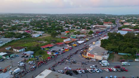 Panoramic-orbit-on-crowds-of-people-waiting-on-side-of-street-road-for-parade