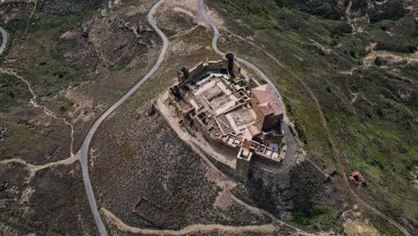 Wide-angle-aerial,-overlooking-the-plains-of-the-region,-Castle-Montearagón