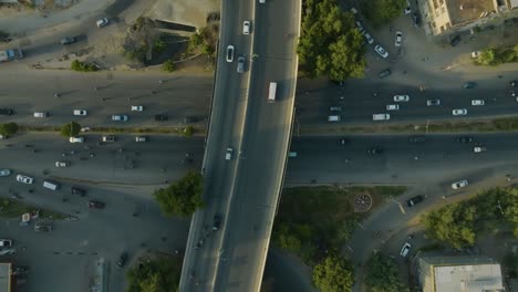 Drone-bird's-eye-view-over-bridge-shahrah-e-faisal-karachi-road-in-karachi