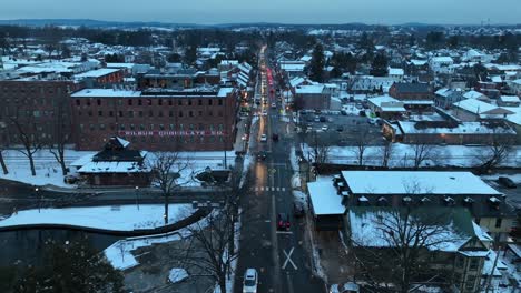Snowflakes-falling-on-small-american-town-during-Christmas-time
