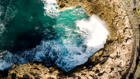 Crashing-waves-create-impressive-water-sprays-at-Devil's-Tears,-East-Bali