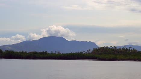 Boat-ride-Nadi-Nausori-Highlands-Tourism-Fiji-Suva-Garden-Island-Taveuni-morning-mountain-peaks-tropical-island-palm-coconut-tree-morning-cloudy-blue-sky-calm-bay-shore-Coral-coastline-parallax-zoom