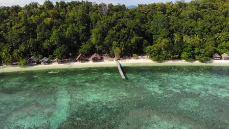 Turquoise-and-shallow-sea-water-of-Kri-island,-West-Papua-in-Indonesia