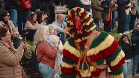 Caretos-Amidst-Tourists-in-Podence-Street-Parade,-Portugal