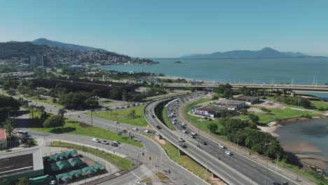 A-bustling-car-intersection-in-Florianópolis,-Santa-Catarina,-Brazil,-capturing-the-vibrant-energy-and-constant-movement-of-urban-life-in-the-city