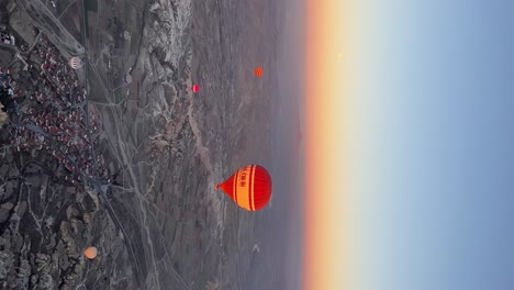 Hot-Air-Balloons-Flying-Up-with-Beautiful-Sunset-Background