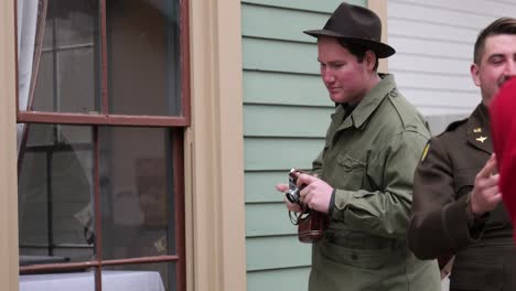 Reenactment-of-1940s-American-photographer-take-a-photo-with-soldier-standing-close-at-the-Ohio-Village-at-the-Ohio-History-Connection