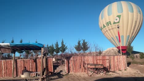 POV-from-Car-Driving-Along-Cappadocia-Road-with-View-of-Hot-Air-Baloons-Landed-on-Savannah