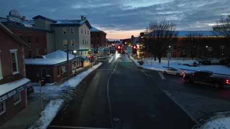 Car-on-street-in-historic-American-town-at-golden-sunset