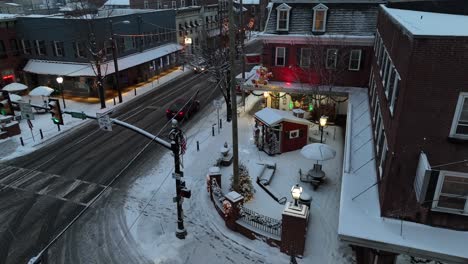 Small-town-square-in-USA-during-snow-flurries-at-dusk