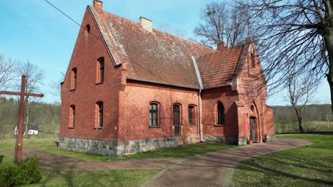 Old,-historic-brick-church,-early-spring,-rural-idyll