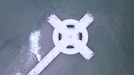 Tourist-boardwalk-in-shape-of-cross-over-the-sea