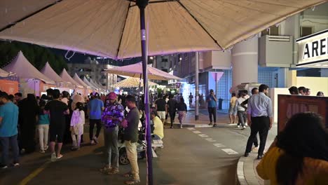 Residents-enjoy-the-Ramadan-street-food-festival-as-Karama's-Sheikh-Hamdan-Colony-transforms-with-lights-and-food-stalls-in-Dubai,-UAE