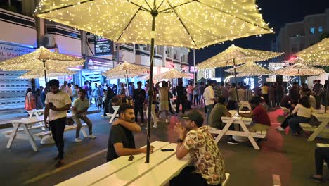 Residents-enjoy-the-Ramadan-street-food-festival-as-Karama's-Sheikh-Hamdan-Colony-transforms-with-lights-and-food-stalls-in-Dubai,-UAE