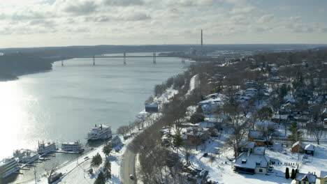 Winter-Aerial-of-Stillwater,-MN-with-Riverboats-and-Bridge