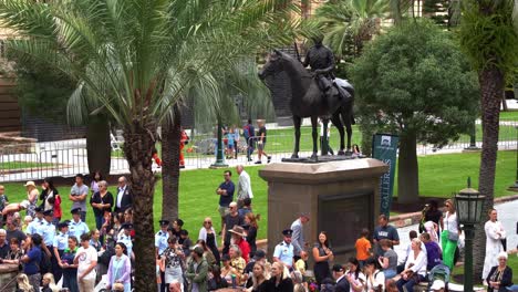 Large-crowds-of-people-gather-in-downtown-Brisbane-city,-swelling-with-anticipation-before-the-commencement-of-the-annual-tradition-Anzac-Day-parade-at-Anzac-Square