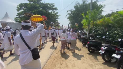 Hindu-religious-congregations-procession-to-Samuh-beach-Bali-for-the-melasti-ceremony,-ahead-of-the-silent-day-of-Nyepi