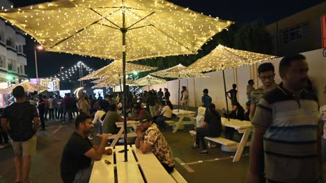 Residents-enjoy-the-Ramadan-street-food-festival-as-Karama's-Sheikh-Hamdan-Colony-transforms-with-lights-and-food-stalls-in-Dubai,-UAE