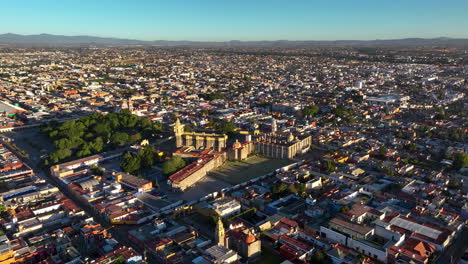 Aerial-View-Circling-The-Convento-De-San-Gabriel-Arcángel,-Golden-Hour-In-Cholula,-Mexico