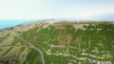 Madeira-Lombo-do-Mouro-viewpoint-summit-aerial-view-mountain-clouds-passing-across-Madeira-wind-turbine-farm