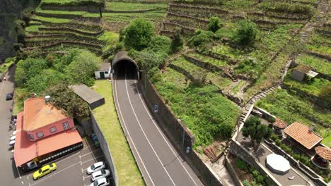 Seixal-village-terraced-hillside-aerial-view-overlooking-João-Delgado-traffic-entering-mountain-road-tunnel