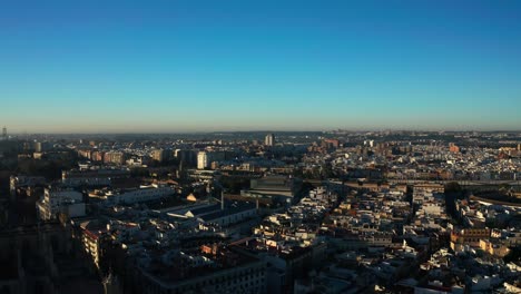 Drone-Panorama-Of-Seville-City-At-Sunset-In-Andalusia,-Southern-Spain