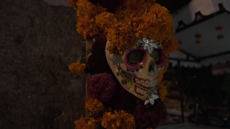 Skull-adorned-with-cempasuchil-flowers,-Oaxaca,-Mexico