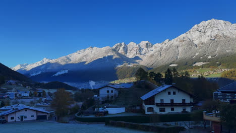 Early-November-Europe-Australian-Swiss-Alps-fall-autumn-Stubai-Village-chalet-Tirol-Austria-first-light-morning-sunny-shaded-first-snow-on-peaks-cloudy-foggy-Innsbruck-chalet-landscape-pan-left
