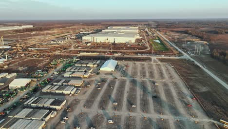 Low-approaching-aerial-of-Ford's-Megacampus,-BlueOval-City-at-Sunset-in-Stanton,-TN