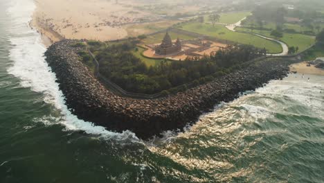 Aerial-Dolly-Back-View-Of-Shore-Temple-Overlooking-Bay-Of-Bengal-In-Chennai