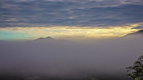 Time-lapse-sunset-sun-setting-at-Austrian-alps-mountain-landscape-clouds-motion-at-countryside-european-Alps,-calming-scene