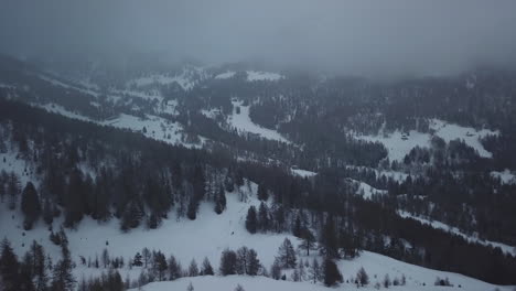 Aerial-drone-shot-of-snowy-mountain-landscape