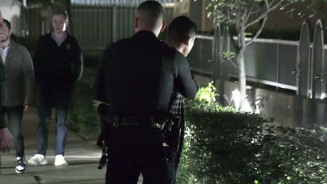 lapd-police-officer-walking-around-scene