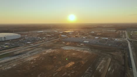 Aerial-pullaway-of-Ford's-Megacampus,-BlueOval-City-in-Stanton,-TN-during-a-beautiful-sunset