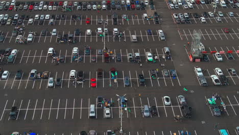 Baseball-Fans-With-Green-"SELL"-Flags-At-Parking-Lot-Of-Oakland-Athletics-During-Opening-Game-In-Oakland,-California